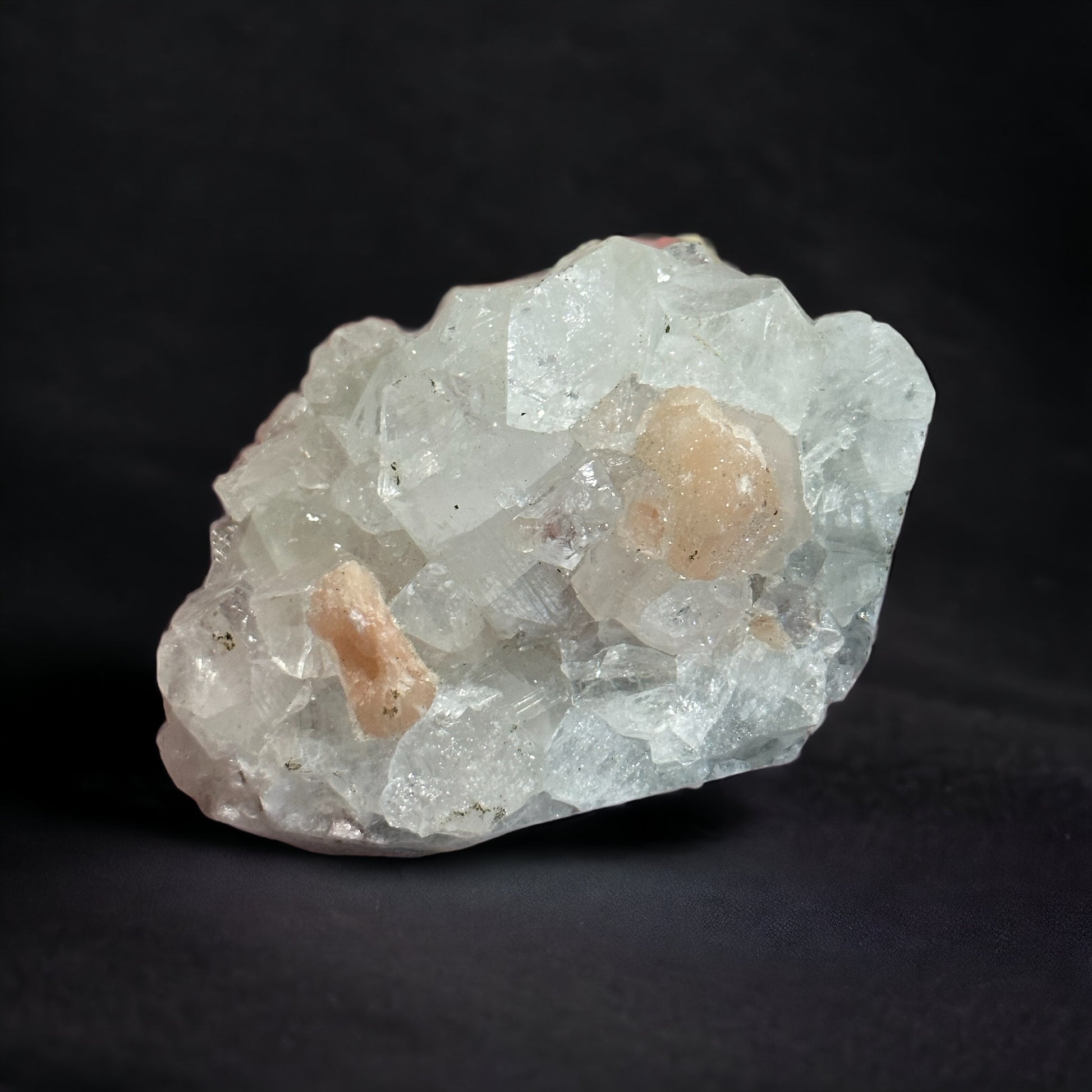 Apophylite with peach stilbite crystal cluster