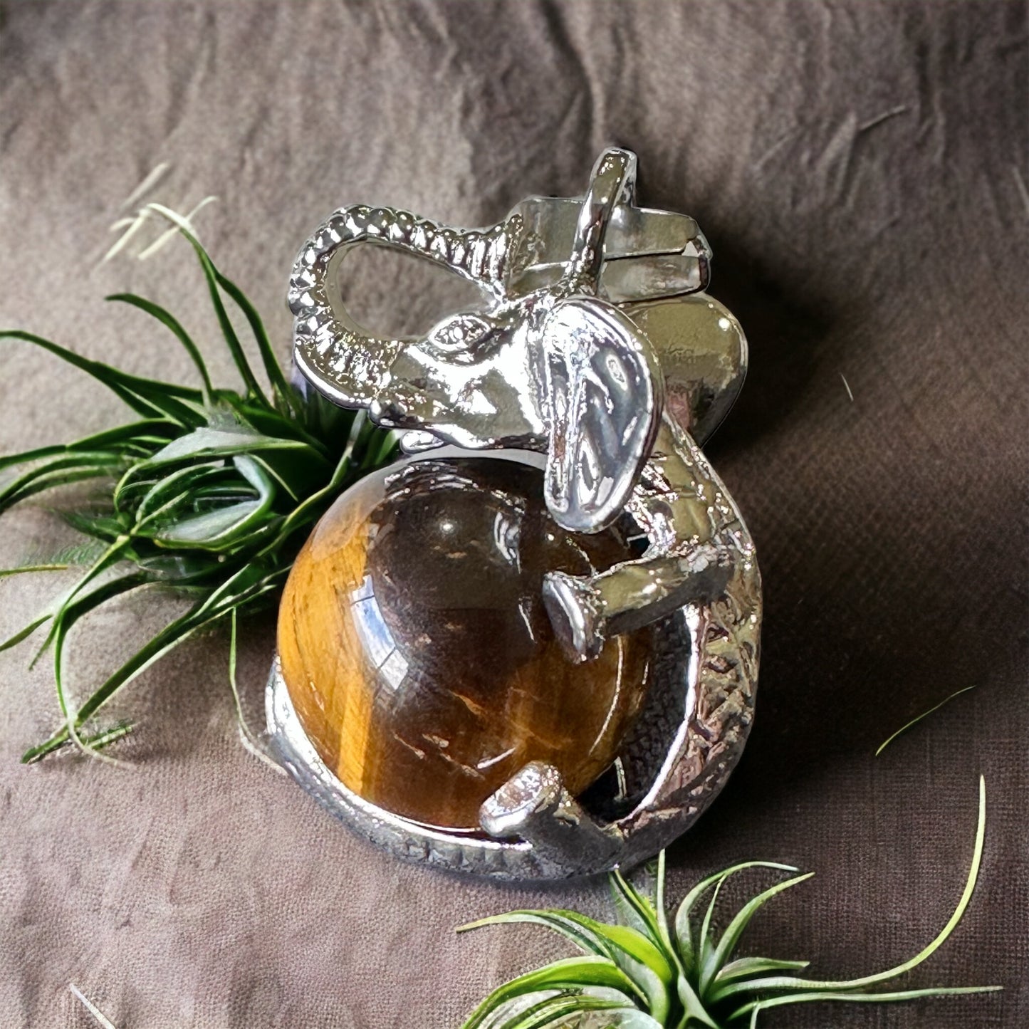 Elephant and crystal sphere pendant